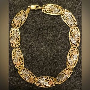 10K Tri-Color Yellow Gold Link Bracelet with Rose Gold Flowers.